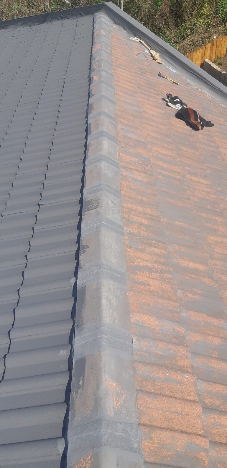 Roofers on tile roof